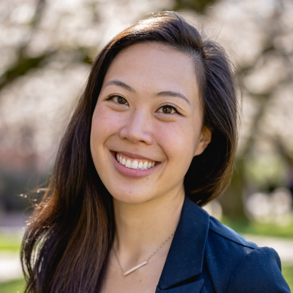 A smiling photo of Hsuan Hsuan Dai, Hall Health. Hsuan has long brown hair and is wearing a blue jacket.