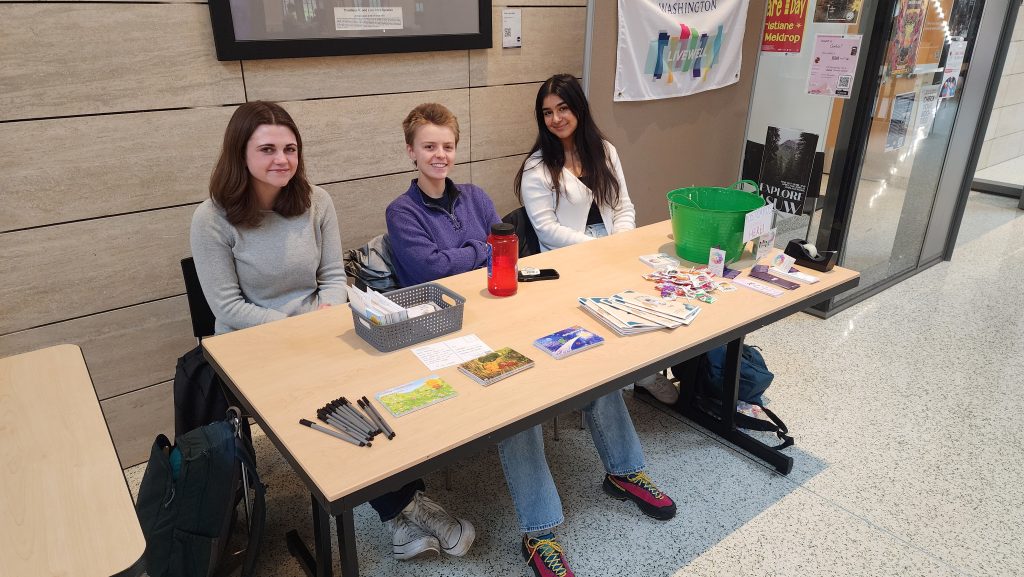 Photo of LiveWell Tabling with 3 peer health educators sharing resource information