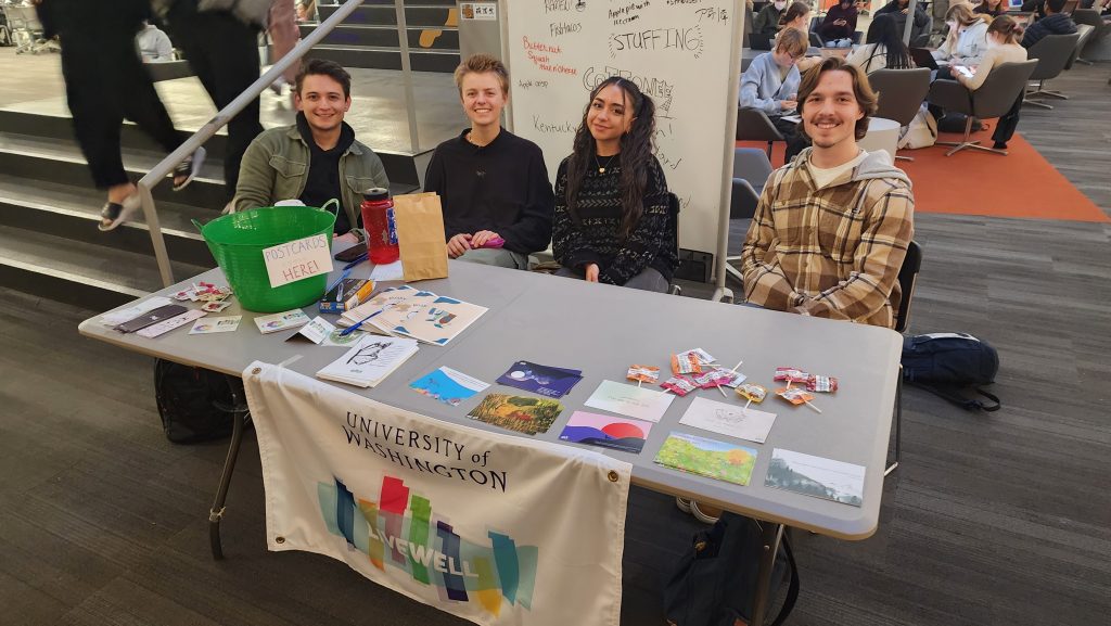 Photo of LiveWell Tabling with 4 peer health educators sharing resource information