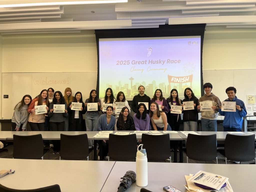 Participants celebrating at a LiveWell Great Husky Race event